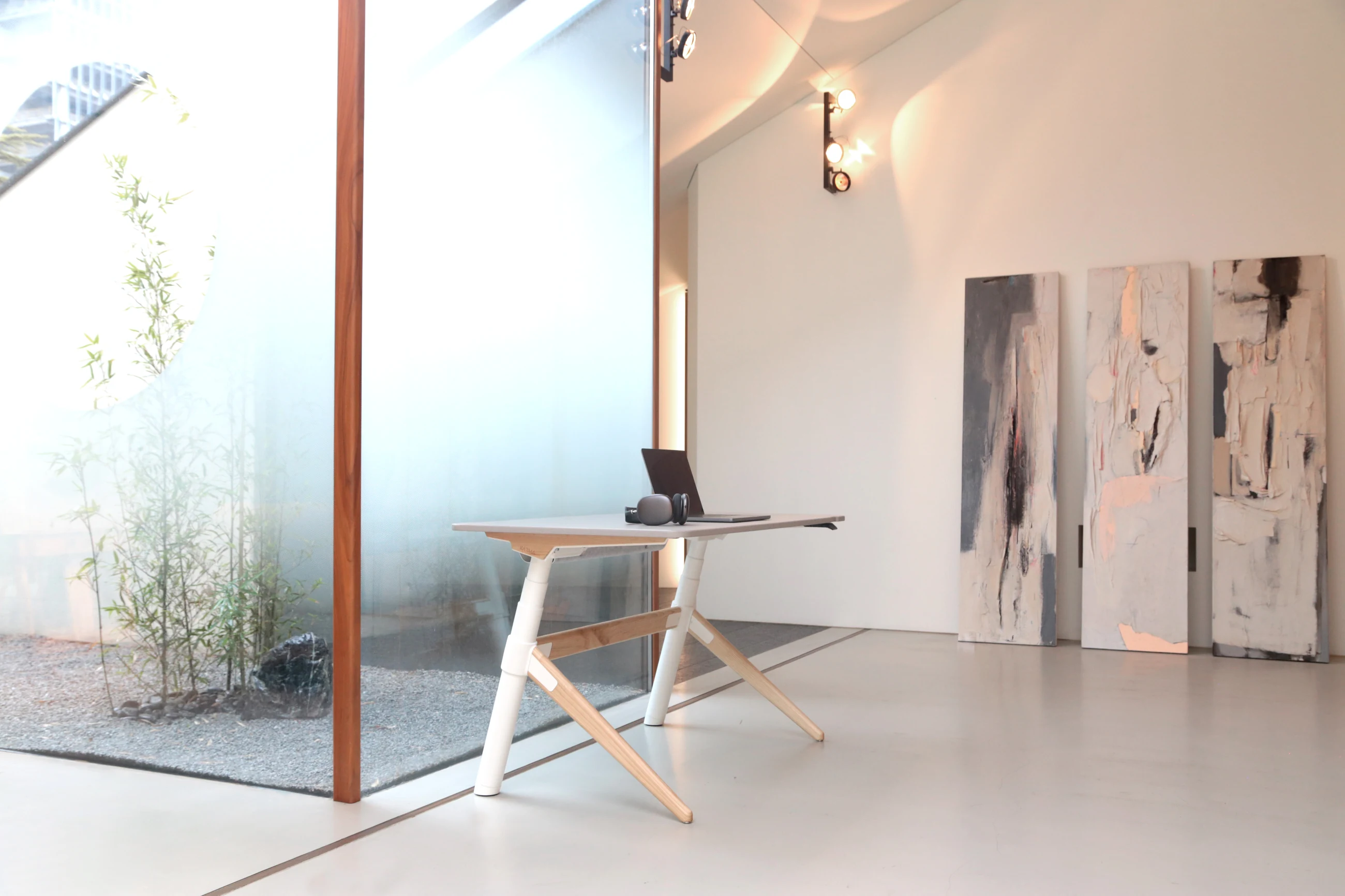 Karma Essence height-adjustable workstation in an architectural interior